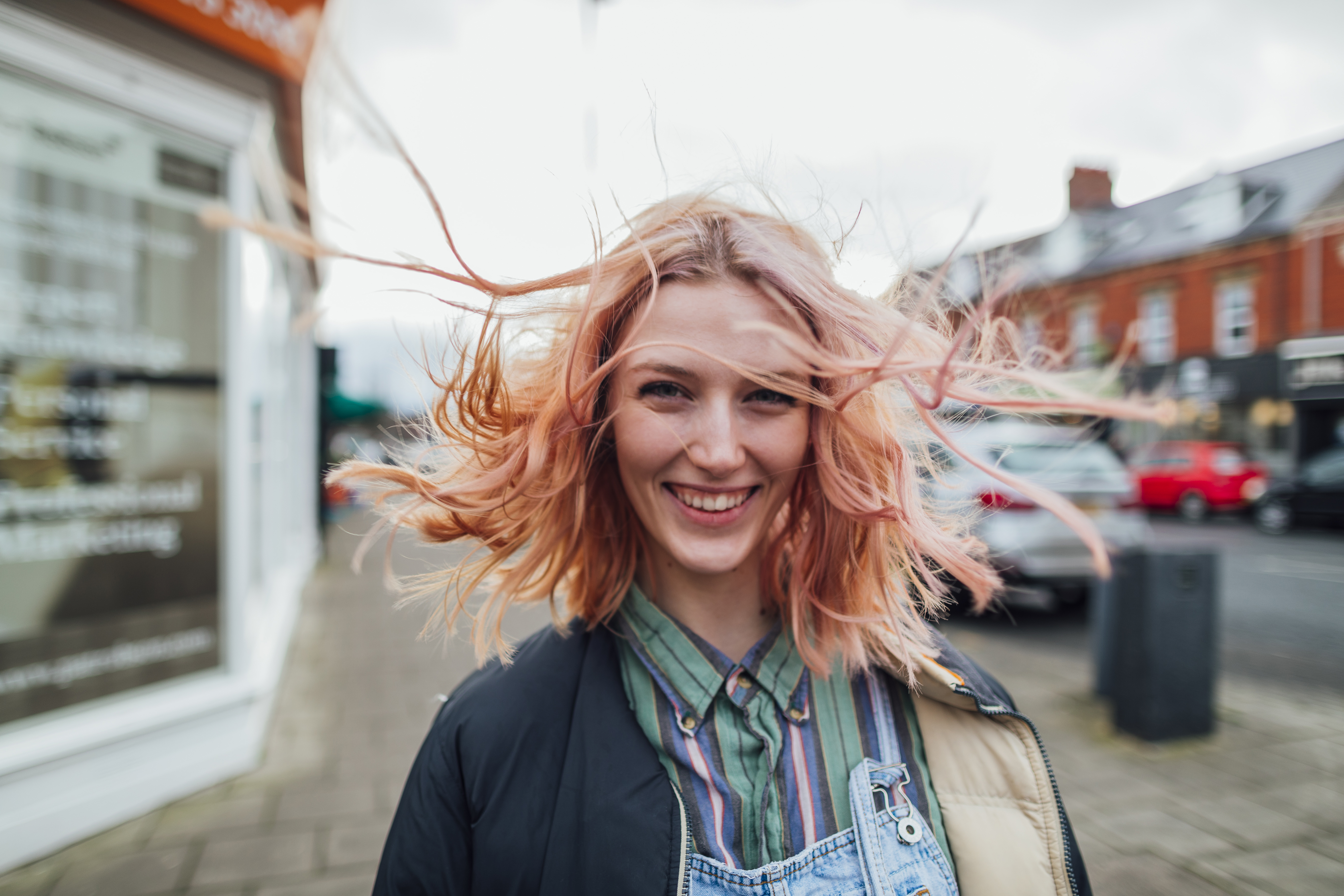 smiling woman in the street